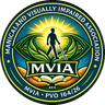 Manicaland Visually Impaired Association (MVIA) logo — a person with a cane walking toward the sun, framed by an eye of leaves above hands holding a book