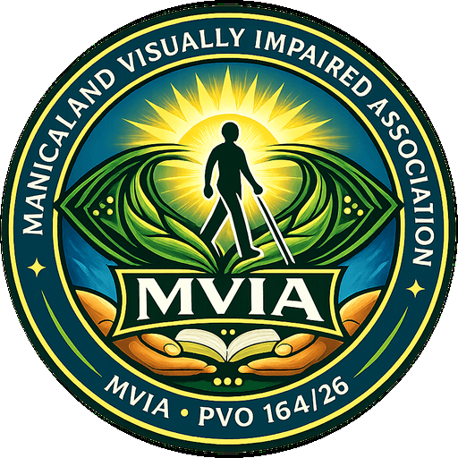 Manicaland Visually Impaired Association (MVIA) logo — a person with a cane walking toward the sun, framed by an eye of leaves above hands holding a book